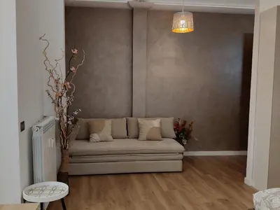 a living room with a couch and a table at Metro Re di Roma Apartment in Rome