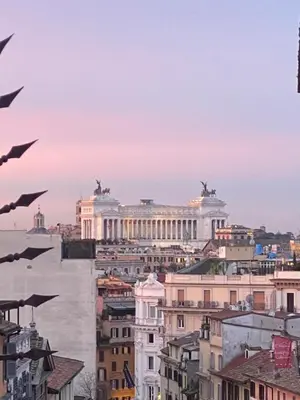 a view of the louvre from the roofs of buildings at La casa di Francesco in Rome