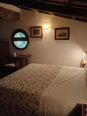 a bedroom with a bed and a window at Roman Babuino Inn in Rome