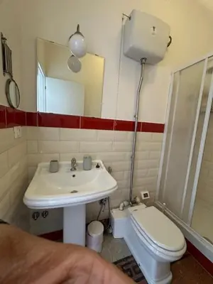 a bathroom with a sink and a toilet at La Casa di Bru - Cinque Camere - Dieci posti - Terrazzo in Rome
