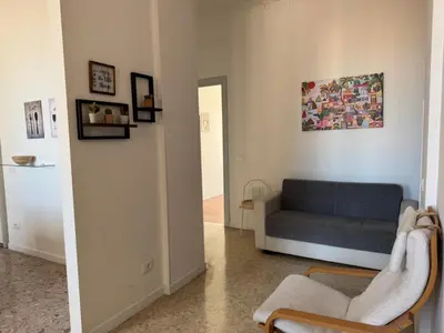 a living room with a couch and a chair at La Casa di Bru - Cinque Camere - Dieci posti - Terrazzo in Rome