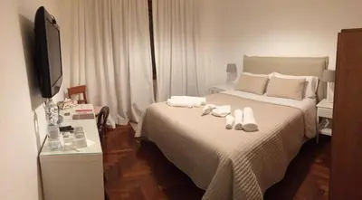 a hotel room with a bed with towels on it at Attico 203 in Rome
