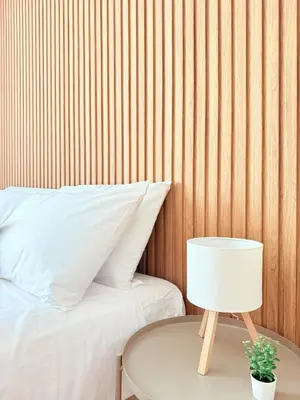a table with a lamp next to a bed at Santa Maria Apartment Rome in Rome