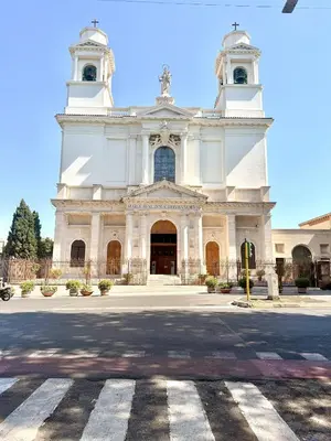 a large white church with a crosswalk in front of it at Santa Maria Apartment Rome in Rome
