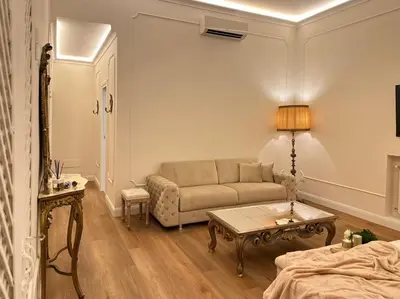 a living room with a couch and a table at Trevi Fountain Elegant Suites by Marianna in Rome