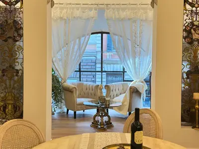 a living room with a couch and a window at Trevi Fountain Elegant Suites by Marianna in Rome
