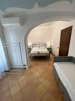 a bedroom with a bed in a room at Dimora Conti in Rome