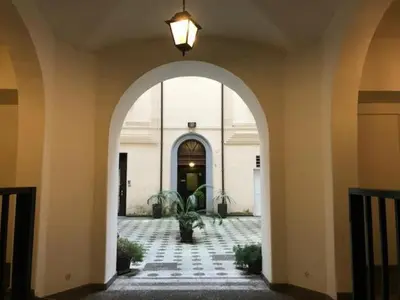 an entry way to a building with an archway at Dimora Conti in Rome