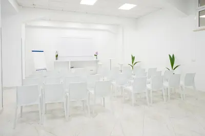a room with white chairs and a whiteboard at Morin 10 Rome Exclusive Suites in Rome