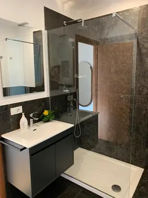 a bathroom with a sink and a shower at Apartment SIX Rome Flaminio - Villaggio Olimpico in Rome