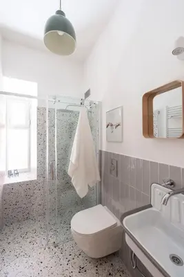 a bathroom with a toilet and a sink and a shower at Casa Chiagio in Rome