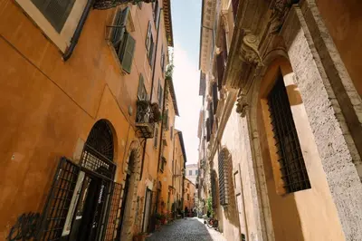 an alley between two buildings in an old town at Maison Luxury Plaza in Rome