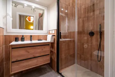 a bathroom with a sink and a shower at Maison Luxury Plaza in Rome