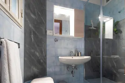 a bathroom with a sink and a shower at Holiday Season in Rome