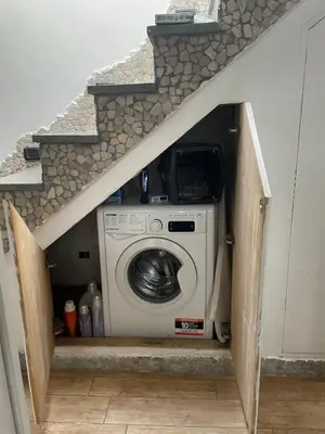 a washer and dryer in a house with an attic at Cozy house with terrace in Rome
