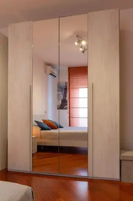 a bedroom with a bed with glass doors at Apartment Casa Girina Boutique in Rome