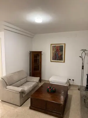 a living room with a couch and a coffee table at Family Entire House in Rome