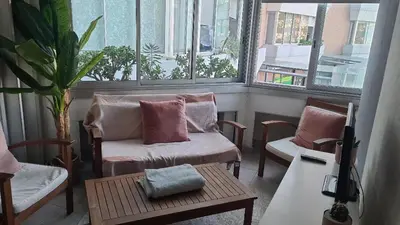 a room with two chairs and a couch and a table at Nuovo appartamento stazione Tiburtina in Rome