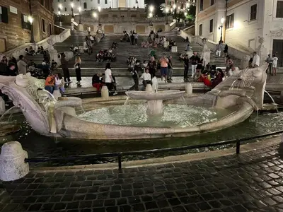 a bridge over a river at night at Casa Valle dei Casali near St Peters Basilica in Rome