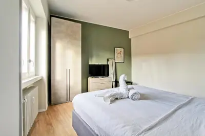 a bedroom with a bed with a stuffed animal on it at Design Monteverde Flat Jenner 70 in Rome