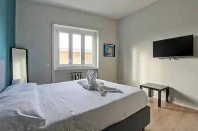a bedroom with a bed with a towel on it at Design Monteverde Flat Jenner 70 in Rome