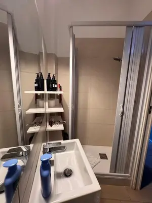 a bathroom with a sink and a shower at Garibaldi Studio Apt in Rome