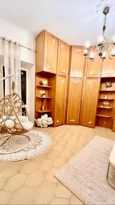 a room with a room with wooden cabinets and a chair at Pantheon Luxury Jacuzzi Apartment in Rome