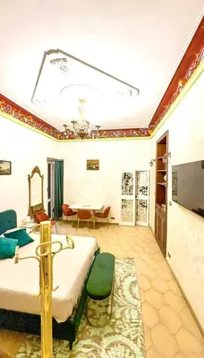 a bedroom with a bed and a dining room at Pantheon Luxury Jacuzzi Apartment in Rome