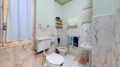 a bathroom with a toilet and a sink at FIORELLA's TERRACE in Rome