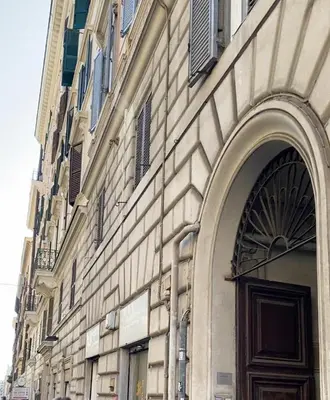 a building with a door and a building with windows at Casa Guardini in Rome in Rome