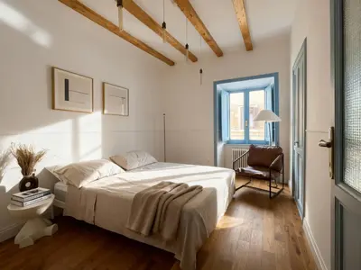 a bedroom with a large bed and a chair at Monti Mood Design Apt - via Urbana - BRAND NEW in Rome