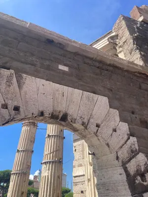 an arch with columns in front of a building at Monti Mood Design Apt - via Urbana - BRAND NEW in Rome