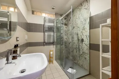 a bathroom with a sink and a shower at Casa Vacanza trastevere in Rome