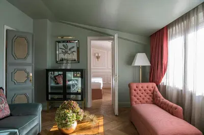a living room with a couch and a bedroom at Hotel d’Inghilterra Roma – Starhotels Collezione in Rome