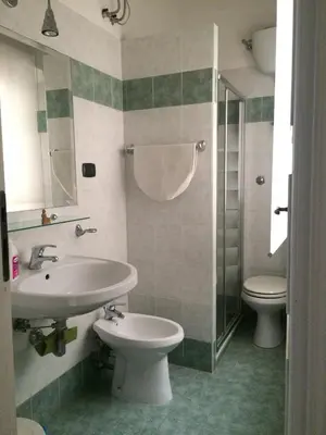 a bathroom with a sink and a toilet at B&B Viale Dei Colli Portuensi 589 in Rome