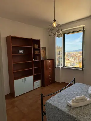 a bedroom with a bed and a window and a dresser at House - Furio Camillo - Too in Rome