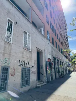 a building with graffiti on the side of it at House - Furio Camillo - Too in Rome