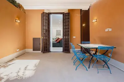 a dining room with a table and chairs at Skylife Garden of Olives in Rome