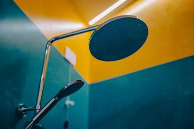 a close up of a shower head in a bathroom at Skylife Garden of Olives in Rome