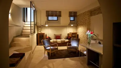a living room with two chairs and a couch at Vatican design loft in Rome