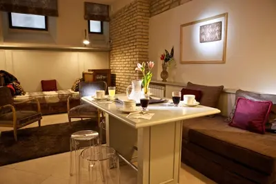 a living room with a table and a couch at Vatican design loft in Rome