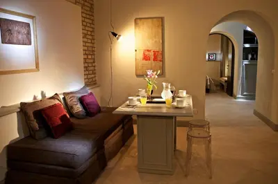 a living room with a couch and a table at Vatican design loft in Rome
