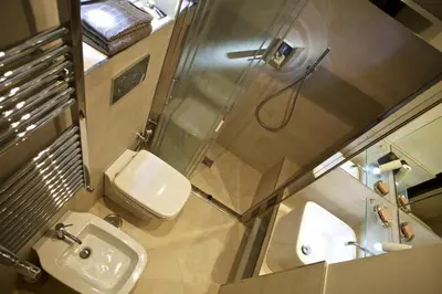 a bathroom with a toilet and a sink and a shower at Vatican design loft in Rome
