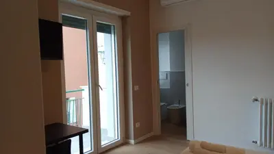 a bathroom with a glass shower and a sink at TiburtinaStay in Rome
