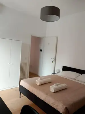 a white bathroom with a sink and a shower at TiburtinaStay in Rome