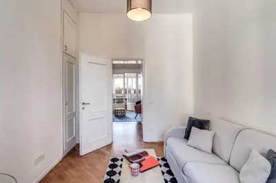a living room with a couch and a table at Porta maggiore 2 bedroom with terrace in Rome