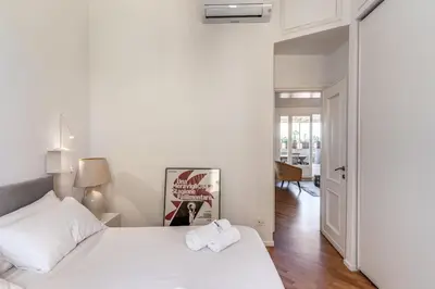 a bedroom with a white bed with two towels on it at Porta maggiore 2 bedroom with terrace in Rome