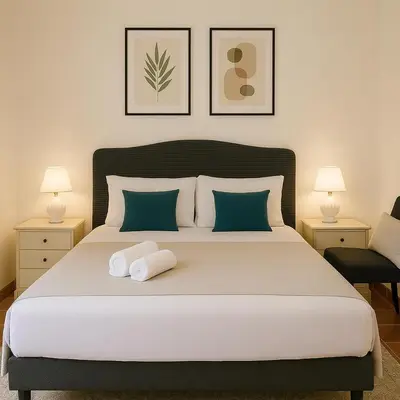 a bedroom with a large bed with two pillows at Cola di Rienzo Attico & Charme - by 101 Flats in Rome