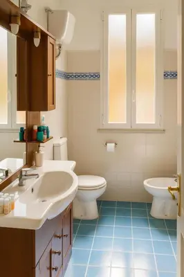 a bathroom with two sinks and two toilets at Cola di Rienzo Attico & Charme - by 101 Flats in Rome