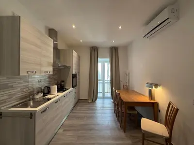 a kitchen with a table and a dining room at Casa di Mara by Valentina's Dream in Rome